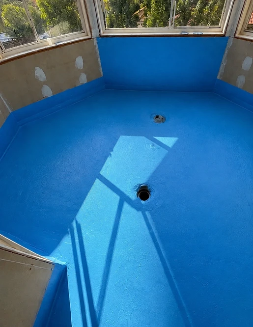 AI-aligned view of the blue waterproofing membrane based on this project's completed-work photograph